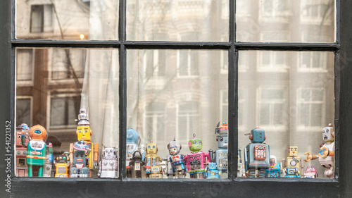 Photography Retro Robot Toys displayed in a window