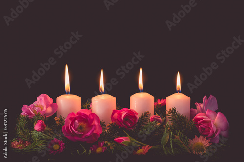 advent candles burning, copy space, isolated, black background