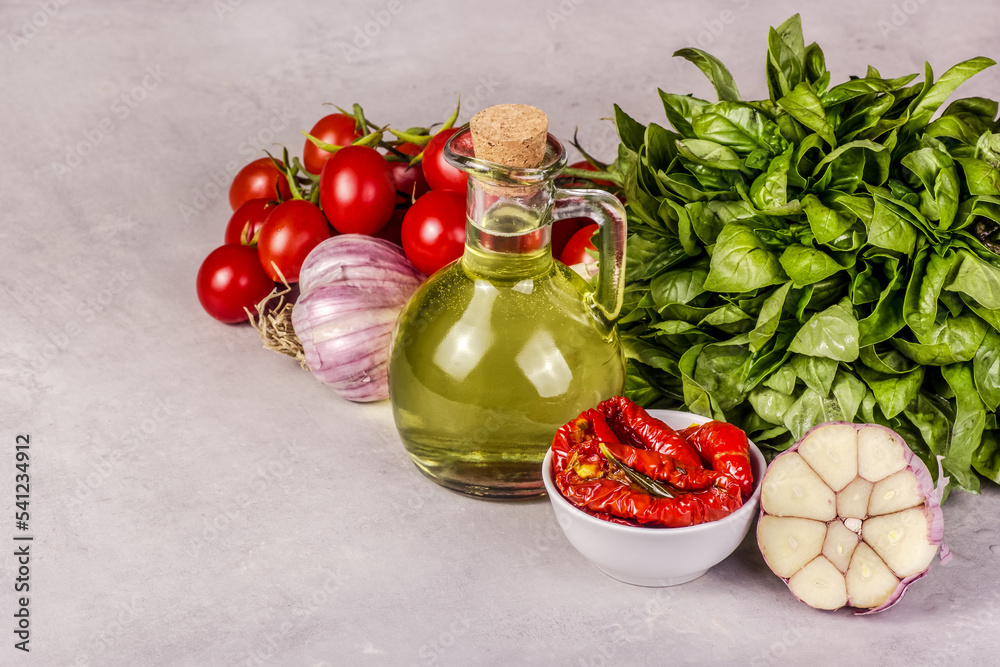 Appetizer with sun-dried tomatoes, garlic and olive oil. Cooking concept.