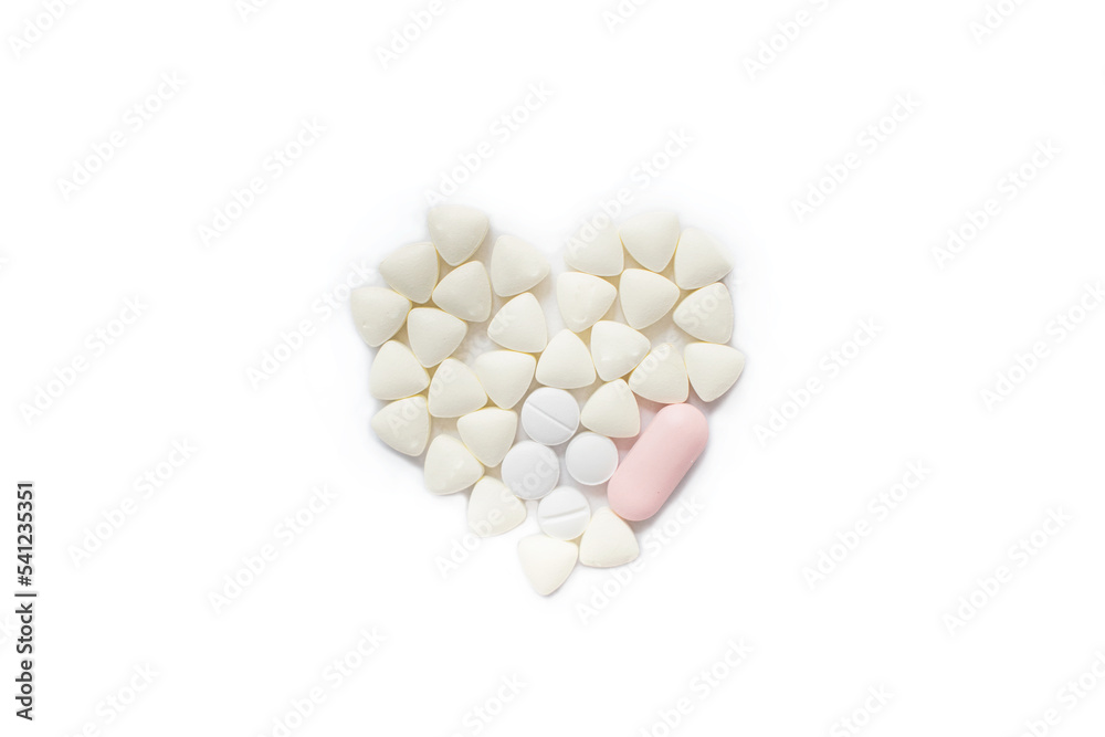 Health concept with heart formed with small pills Health concept with heart formed with small pills
