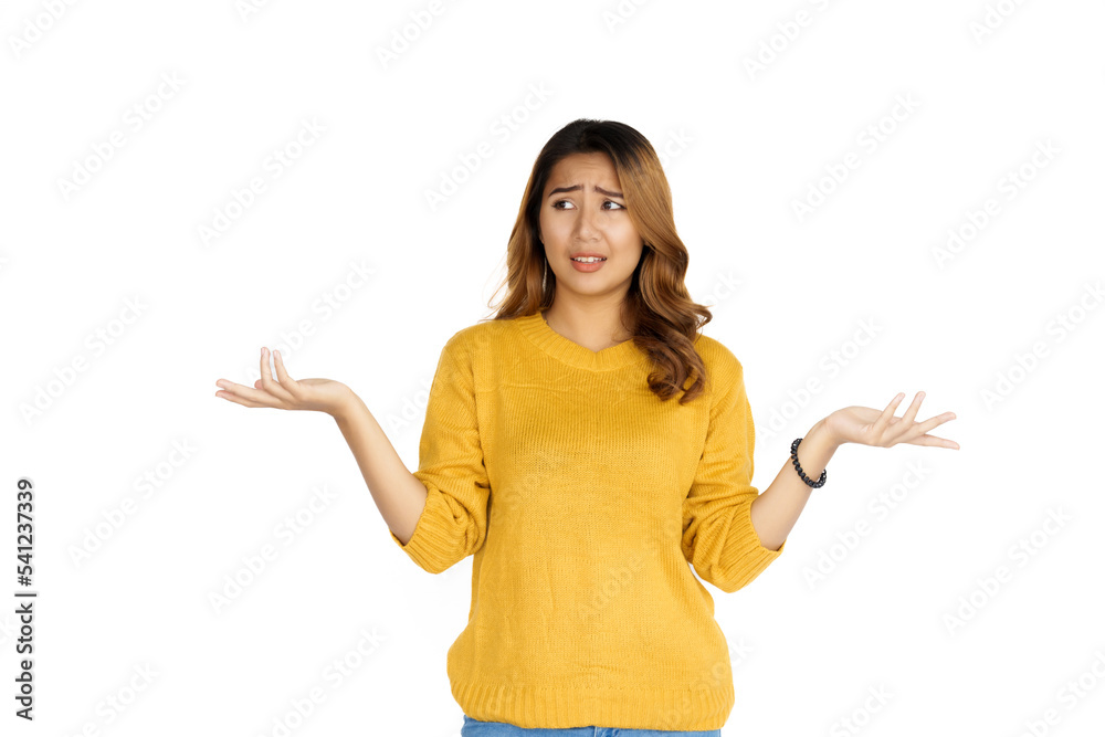 Attractive positive young asian brunette woman in yellow sweater on white background. Attractive positive young asian brunette woman in yellow sweater on white background.