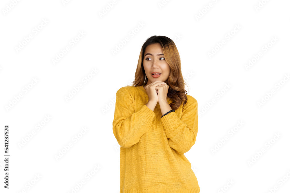 Attractive positive young asian brunette woman in yellow sweater on white background. Attractive positive young asian brunette woman in yellow sweater on white background.