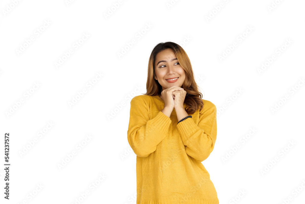 Attractive positive young asian brunette woman in yellow sweater on white background. Attractive positive young asian brunette woman in yellow sweater on white background.