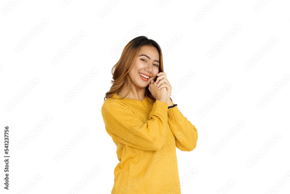 Attractive positive young asian brunette woman in yellow sweater on white background. Attractive positive young asian brunette woman in yellow sweater on white background.