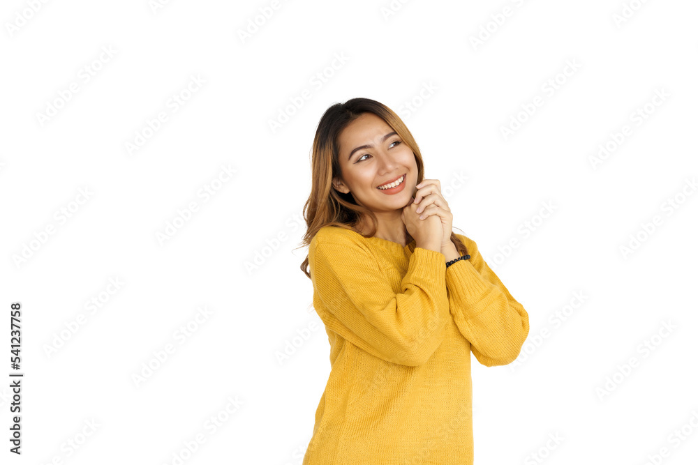 Attractive positive young asian brunette woman in yellow sweater on white background. Attractive positive young asian brunette woman in yellow sweater on white background.