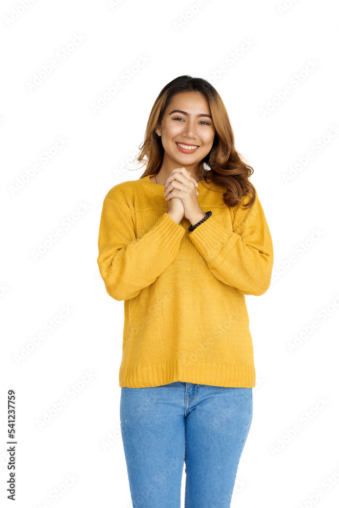 Attractive positive young asian brunette woman in yellow sweater on white background. Attractive positive young asian brunette woman in yellow sweater on white background.