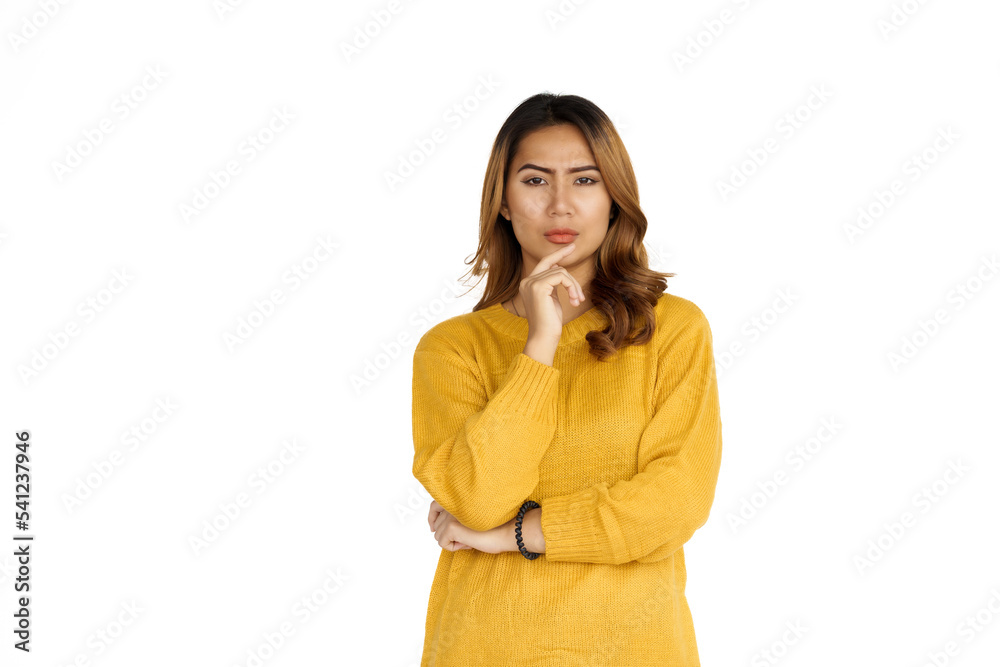 Attractive positive young asian brunette woman in yellow sweater on white background. thinking Attractive positive young asian brunette woman in yellow sweater on white background. thinking