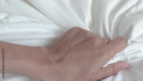 woman hand hold outstretched on white blanket morning bedroom interior.girl palm hold tight the cover.calm relaxed morning or sexual relationship concept 4k real time open palm move fingers young 