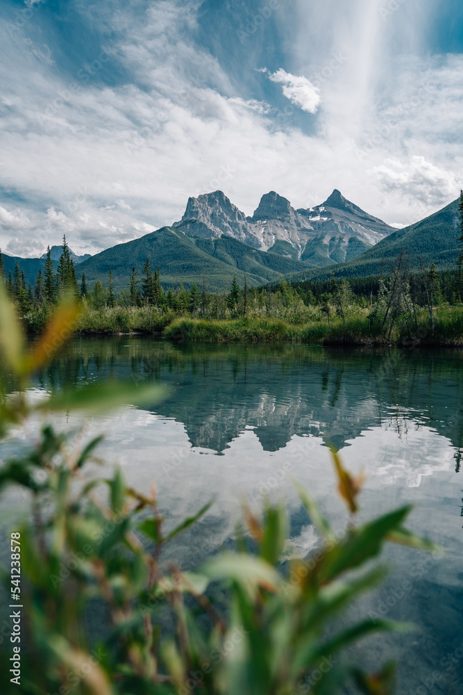 lake reflection of the three sisters in Banff Canada