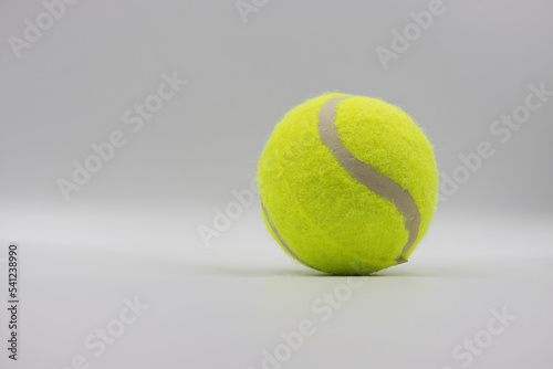 One paddle ball isolated on grey background © Сергей Кураженко