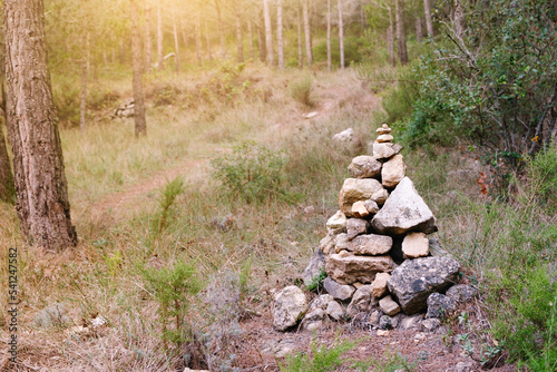 Photography Stones piled up forming a mound at the side of the road.