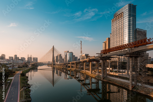 View of Pinheiros River With Modern Buildings Alongside and Famous Octavio Frias de Oliveira Bridge in Sao Paulo City