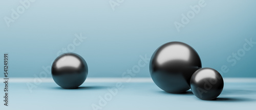 Three shiny black balls or globes in realistic 3D studio interior with copy space for text