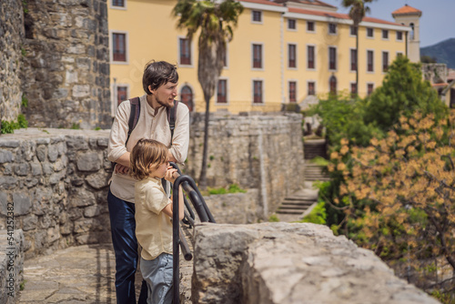 Father and son tourists in Herceg Novi old town. Historical and touristic center of Herceg Novi. Montenegro