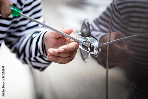 Bilde på lerret Car thief hijack and steal or rob money in car and car breaking door window with