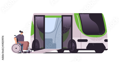 woman in wheelchair moving to lift of public electric bus electrified transportation e-motion EV management