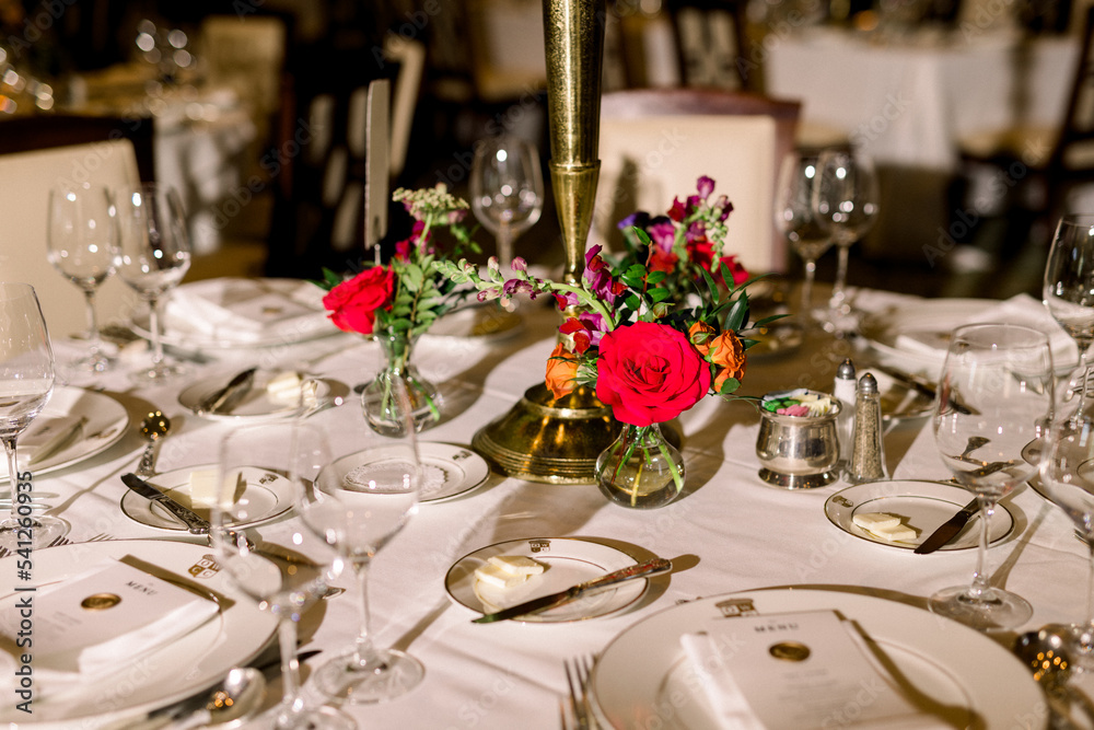 Colorful flower centerpiece on a luxury table at a wedding reception Colorful flower centerpiece on a luxury table at a wedding reception