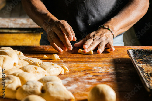elaboration of bread of the dead, november 2, mexican tradition, mexican bread with sesame seeds
