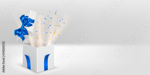 Festive illustration with open white gift box with blue ribbons and bow. Pieces of serpentine and rays of light fly out of it