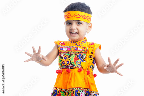 indian little boy Displaying Traditional Indian Costumes Worn During the Hindu Festival of Navratri in the state of Gujarat, India , Isolated, White