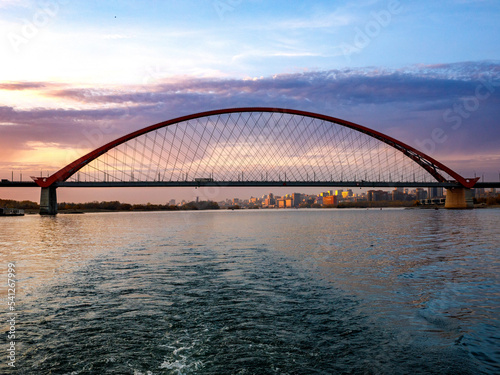 Fototapeta Naklejka Na Ścianę i Meble -  Bugrinsky Bridge over the River Ob in big city Novosibirsk, Russia, sunrise or sunset, evening view