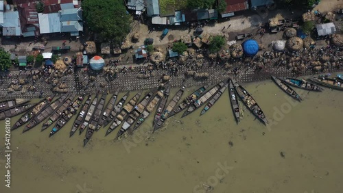 Aerial view of people and boats along the river at Wholesale Jute market in Jamalpur, Bangladesh. photo