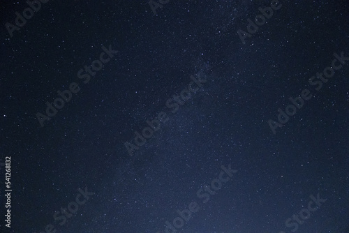 Moonlit sky with stars background