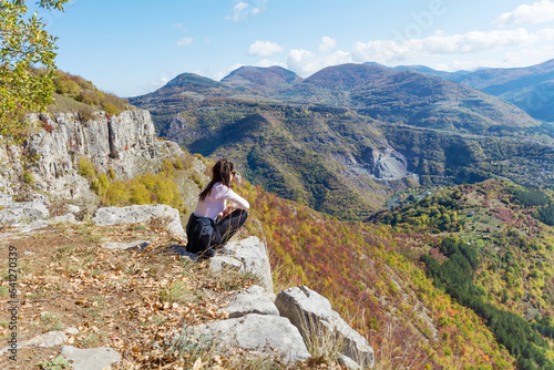 Woman standing high  in the autumn  mountain with stunning panoramic  view . Balkan mountains,  ,Bulgaria