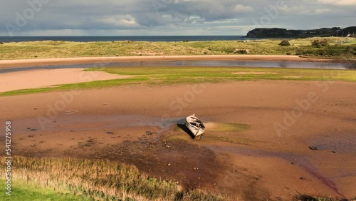 Aerial Video of an old wooden boat wreck at Culdaff Beach Strand on the Co Donegal Coast Ireland  photo