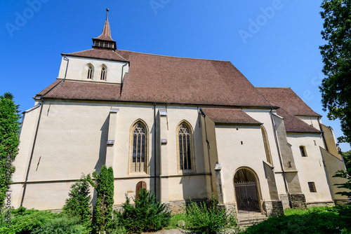 St. Nicholas Hill Lutheran Church (Biserica din Deal Sf. Nicolae) in the old city of Sighisoara, in Transylvania (Transilvania) region, Romania, in a sunny summer day. photo