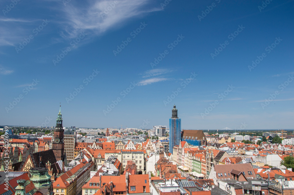 Wroclaw's old town, roofs of tenement houses and the Market Square on a sunny summer day. City.