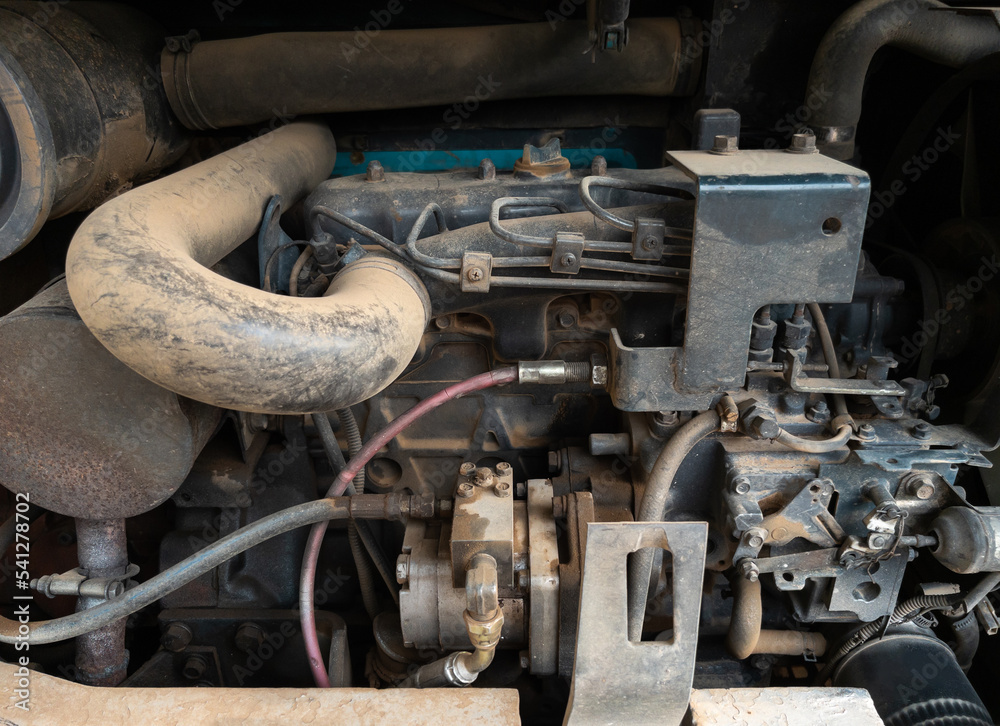 Closeup of the old tractor engine after being used. Closeup of the old tractor engine after being used.