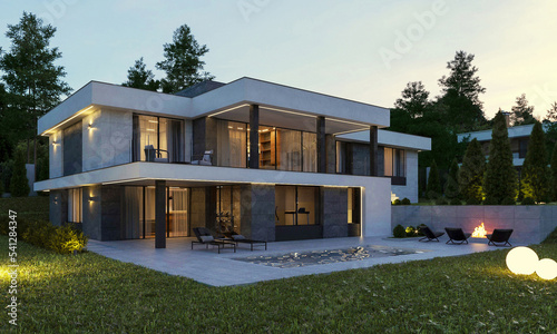Modern house on the relief. Exterior. Evening illumination of the facade. House with swimming pool and large terrace. Modern architecture