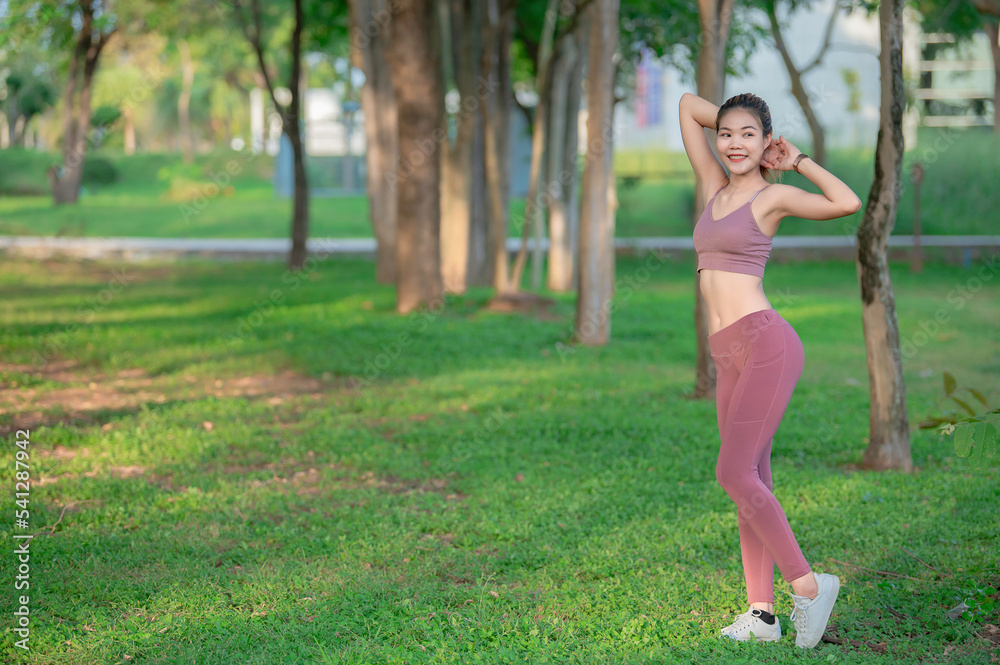 Asian beautiful slim woman at the park,Young girl love healthy exercise,Teen wear sportswear Asian beautiful slim woman at the park,Young girl love healthy exercise,Teen wear sportswear