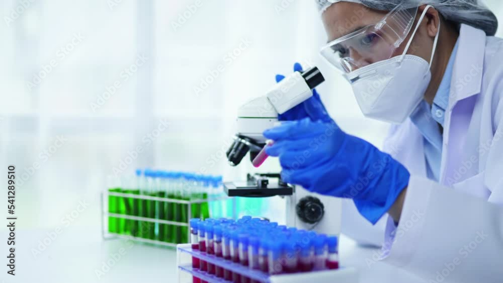 Female scientist is working and using microscope in laboratory and biology laboratory for develop and analysis virus vaccine and medicine. Female scientist is working and using microscope in laboratory and biology laboratory for develop and analysis virus vaccine and medicine.