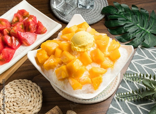 Super Mango Ice cream served in bowl isolated on table side view of taiwan food photo