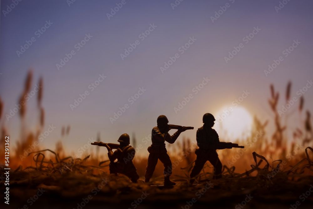 Military scene with  Toy Soldiers on a  Battlefield, concept of war and armed conflict
