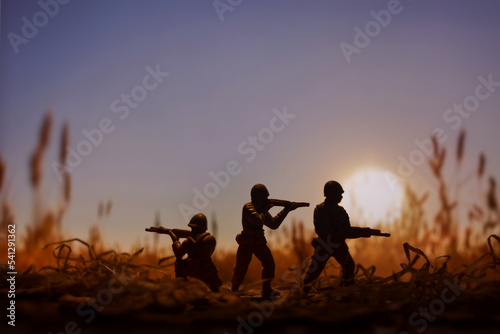 Military scene with Toy Soldiers on a Battlefield, concept of war and armed conflict