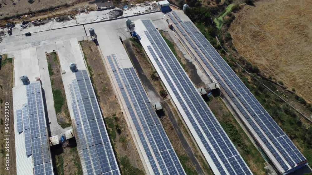Izmir, Turkey - September 16, 2022. Chicken facility and solar panels video view from air and drone. Izmir, Turkey - September 16, 2022. Chicken facility and solar panels video view from air and drone.