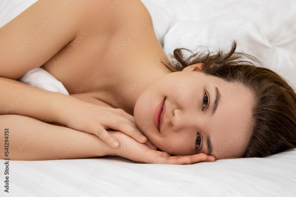 Woman sleeping. High angle view of beautiful young woman lying in bed while covered with blanket. Stock photo Woman sleeping. High angle view of beautiful young woman lying in bed while covered with blanket. Stock photo