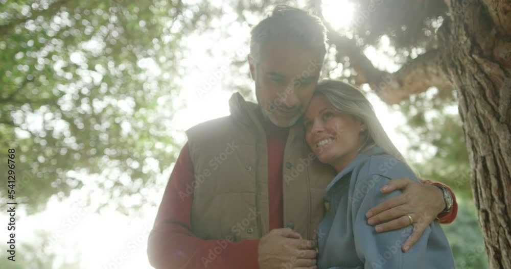 Couple in Love Enjoying the Autumn season Outdoors in Park