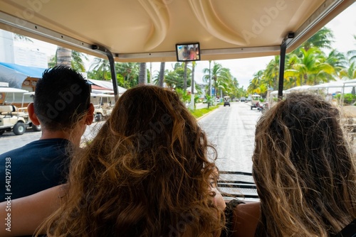 Driving golf cart with people in Isla Mujeres island, Mexico