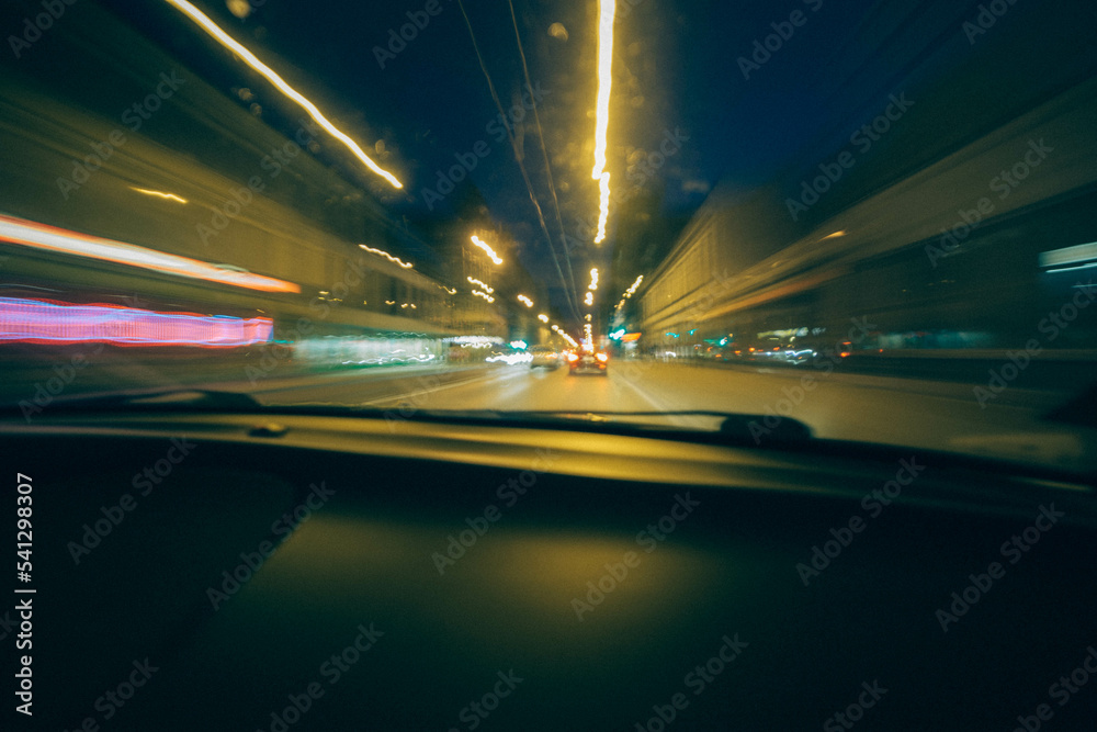 Long exposure to city streets from the car windows, blur lights Long exposure to city streets from the car windows, blur lights