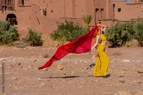 A Beautiful Model Poses Outdoors Near Ait Ben Haddou in Morocco, Africa © Grindstone Media Grp