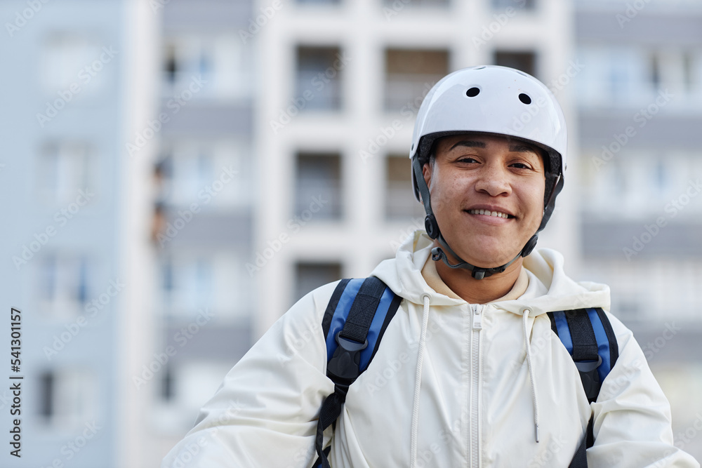 Portrait of smiling woman working in food delivery service, copy space Portrait of smiling woman working in food delivery service, copy space