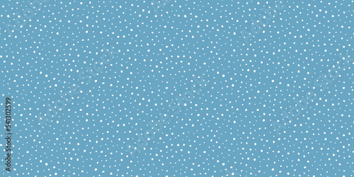 Hand drawn falling snow seamless pattern, uneven round fading chaotic dots, spots, flakes. Sketched white snowflakes on sky blue repeating snowfall background. 