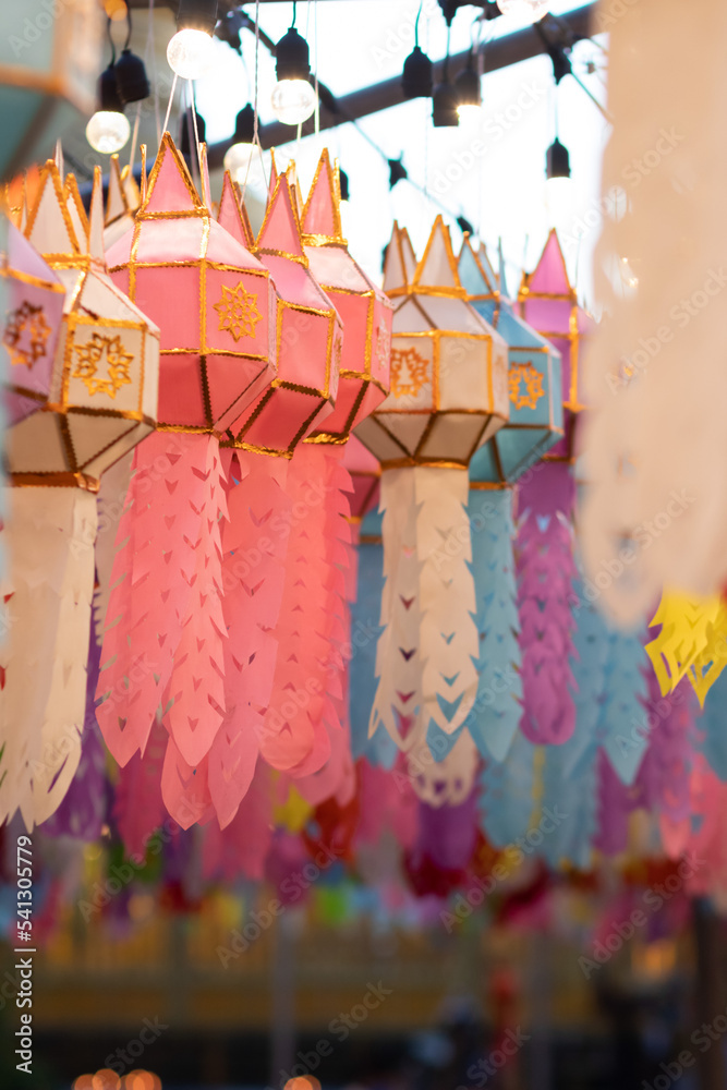 blur background Lantern Festival in Lamphun Province of Thailand is decorated with Lanna style paper lanterns during Loy Krathong Festival, worship of Lord Buddha in Buddhism using paper lanterns.