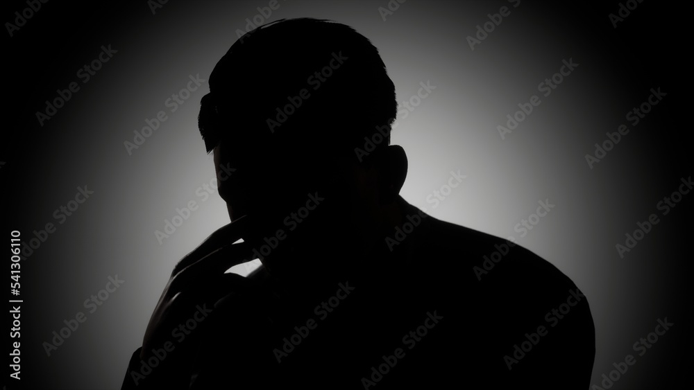 silhouette of a depressed man in black and white style	
