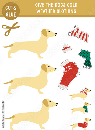 Christmas winter printable activity sheet page for kids. Cut and glue. Give dogs cold weather clothing.