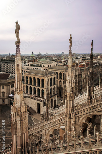 photo taken from the roof of the milan cathedral, where you can admire the view of the square. in detail the spiers that overlook the cathedral